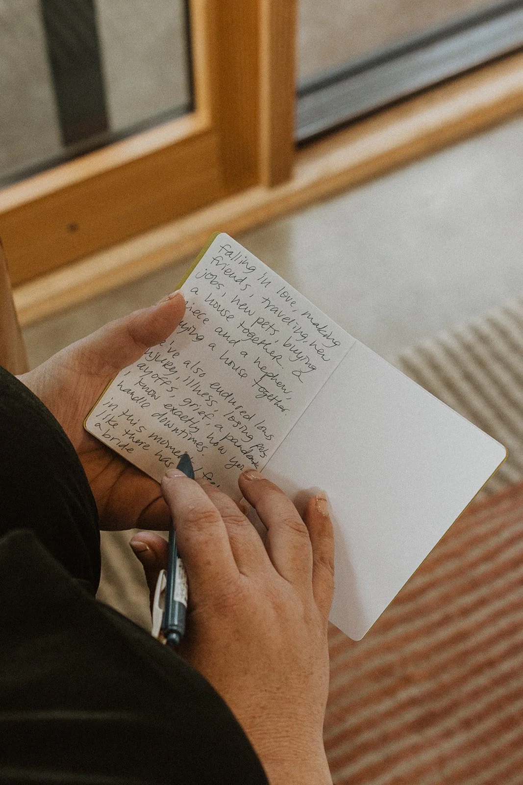 Writing vows by hand in a notebook on the morning of the wedding