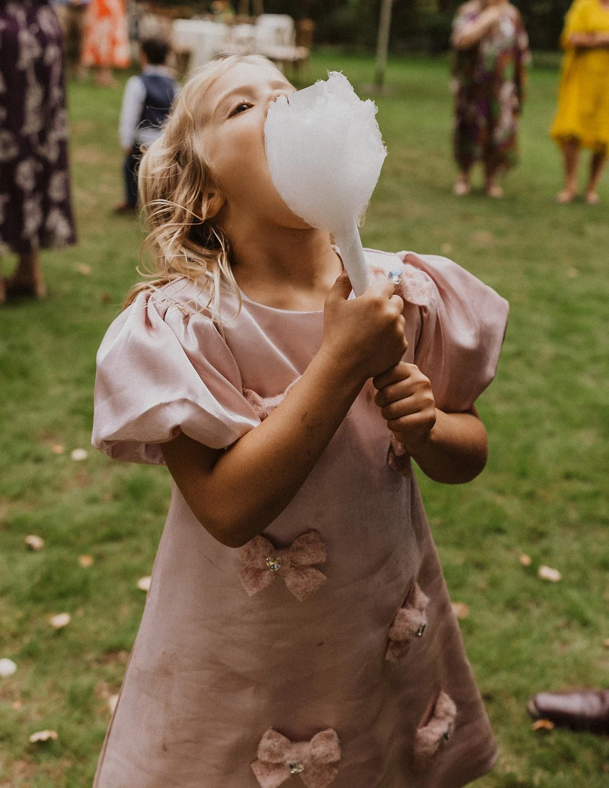 Kids join the cotton candy line after pretending to be above it