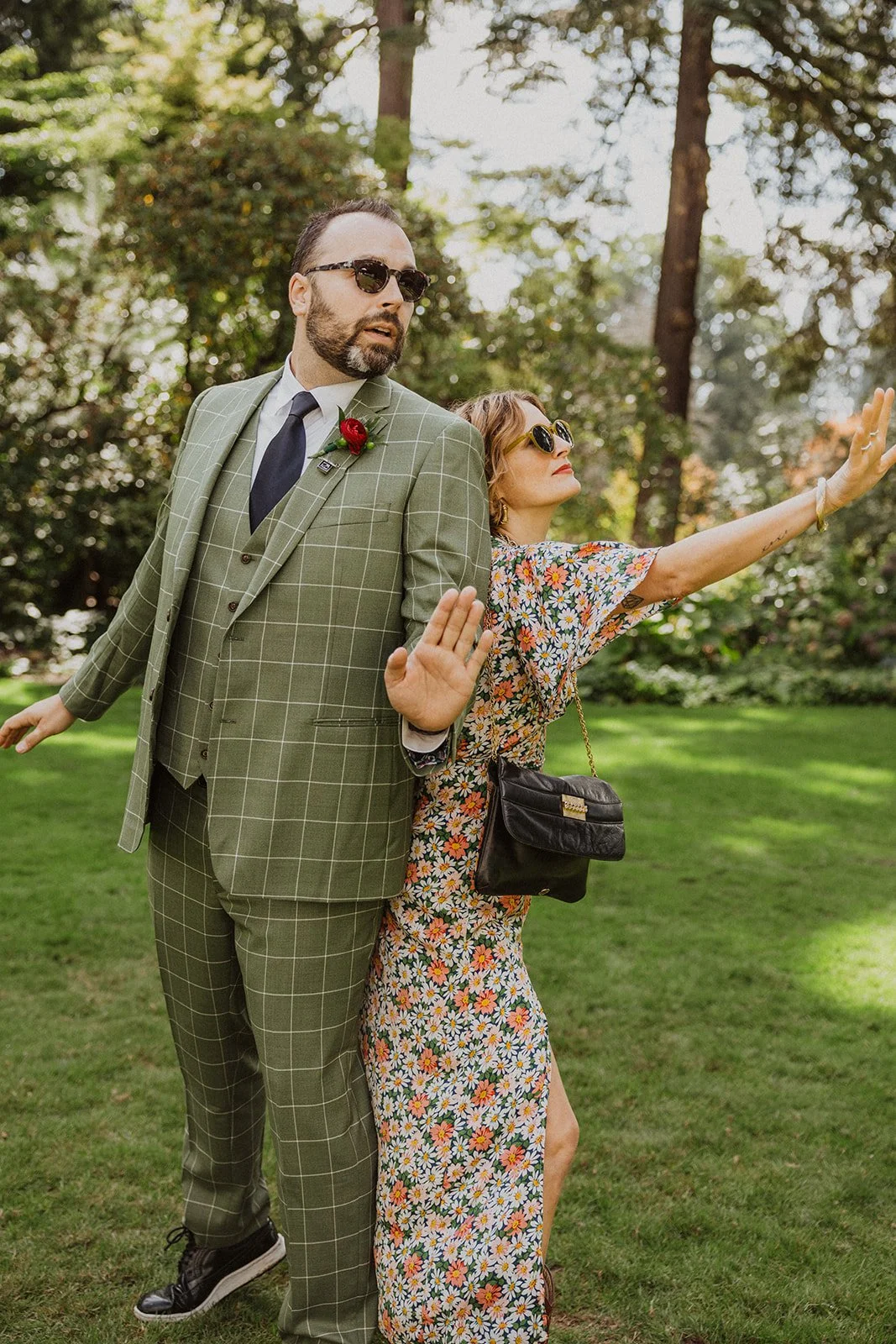 A pair of guests clown for the camera at an Oregon garden wedding
