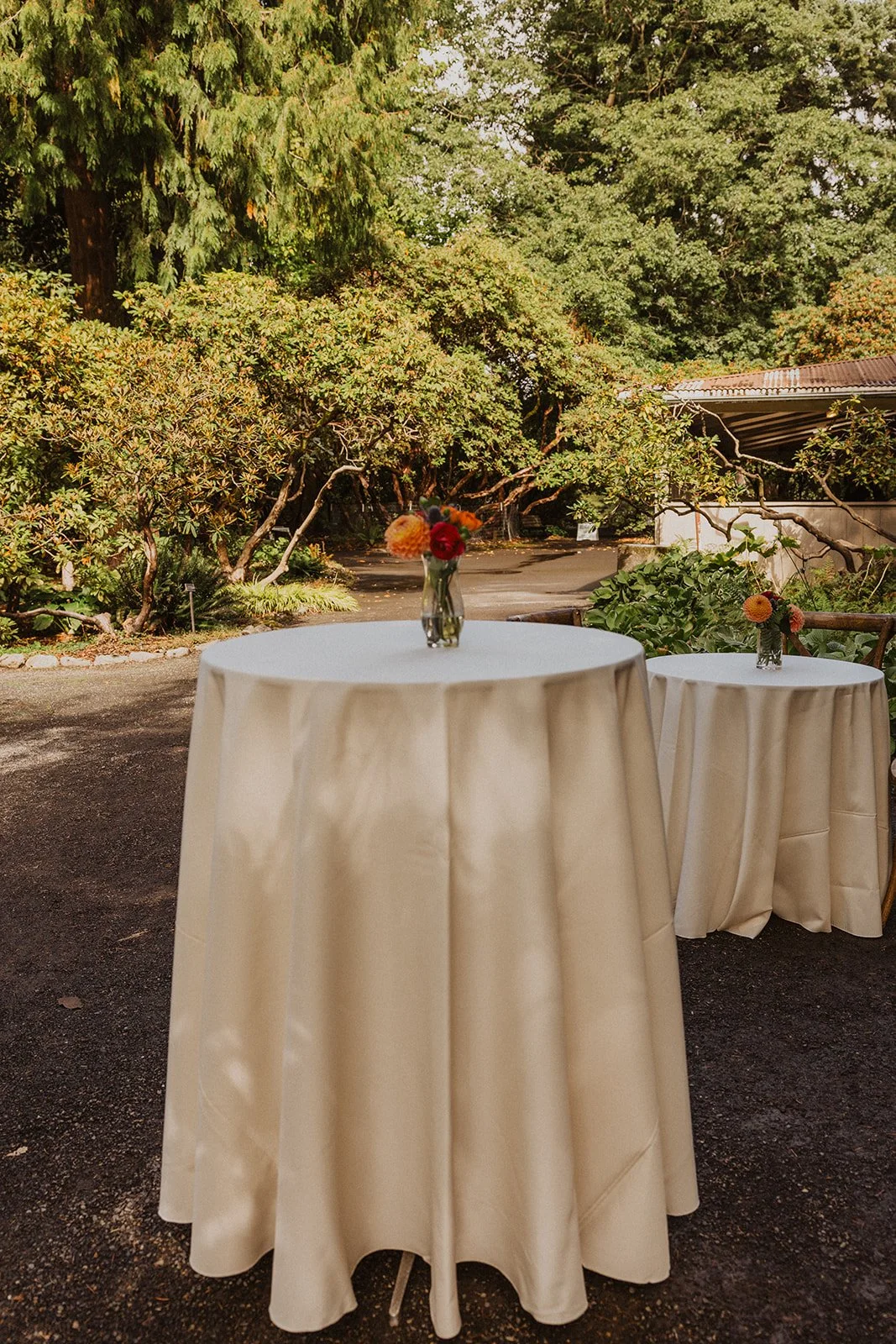 Cocktail tables set out near the gatehouse at Crystal Springs Rhododendron Garden