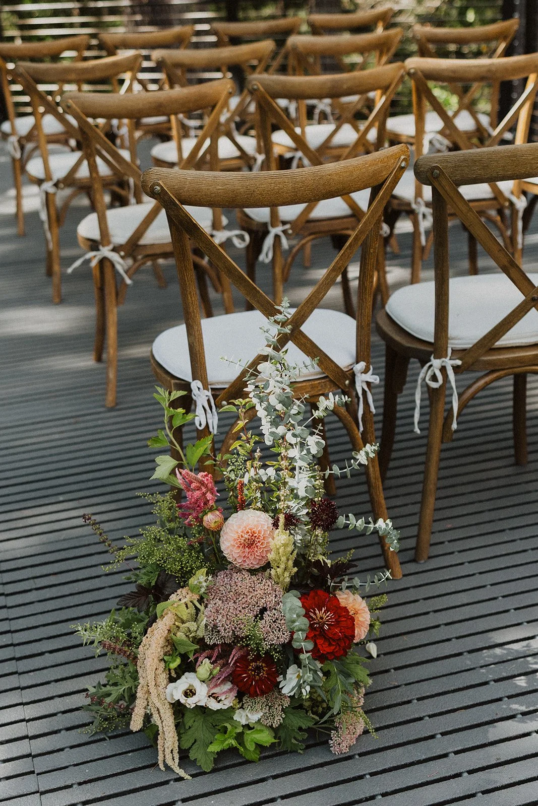 Aisle florals at the end of a chair row at Rocky Hill