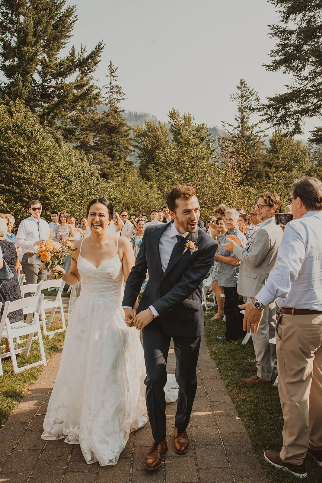 Laughing through tears while walking back up the aisle after vows