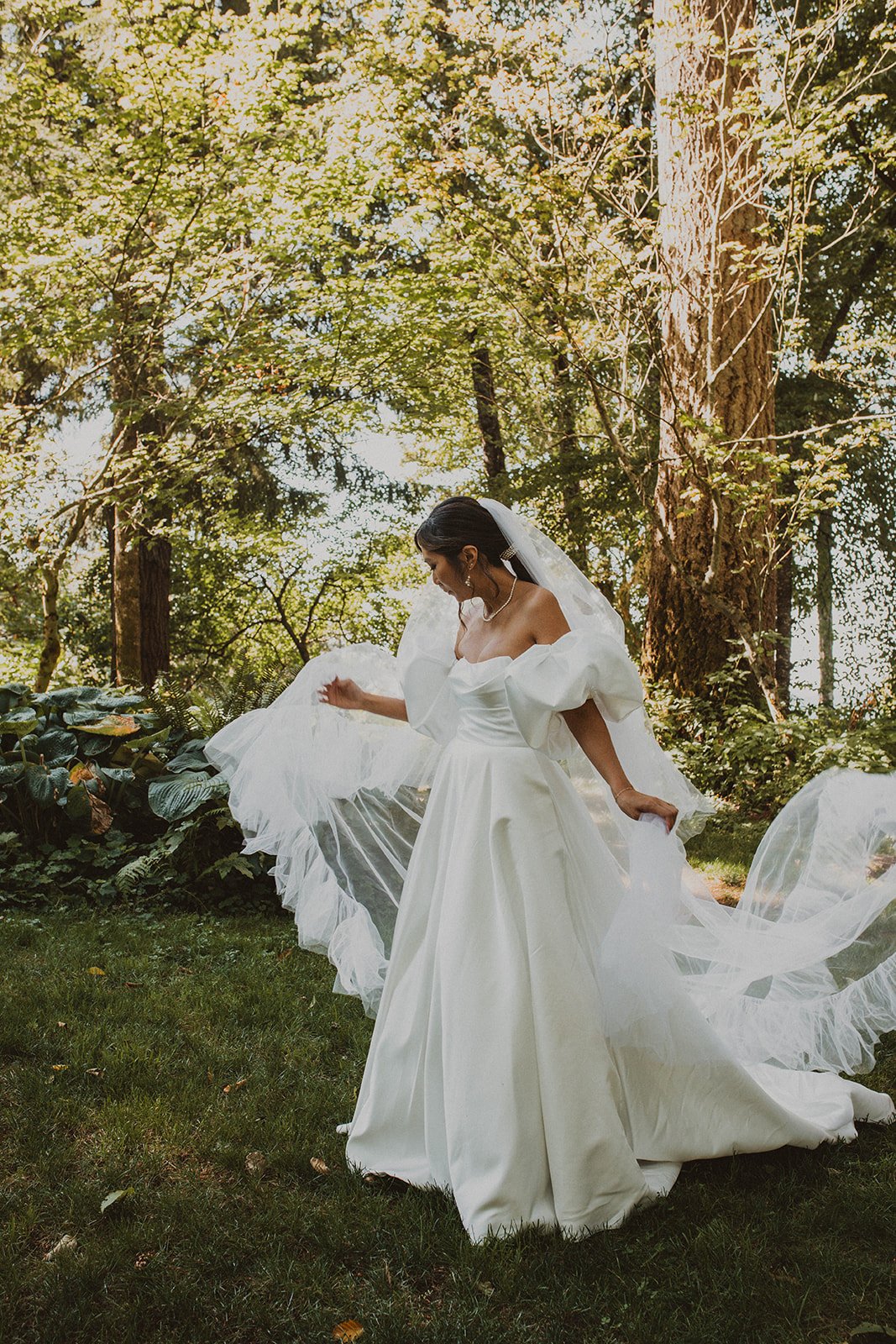 Turning in deep forest with a long veil lifting into the air