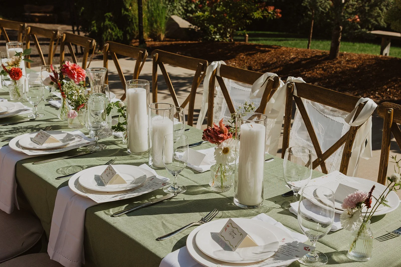 Sage linen, pillar candles and bud vases at a Rocky Hill wedding