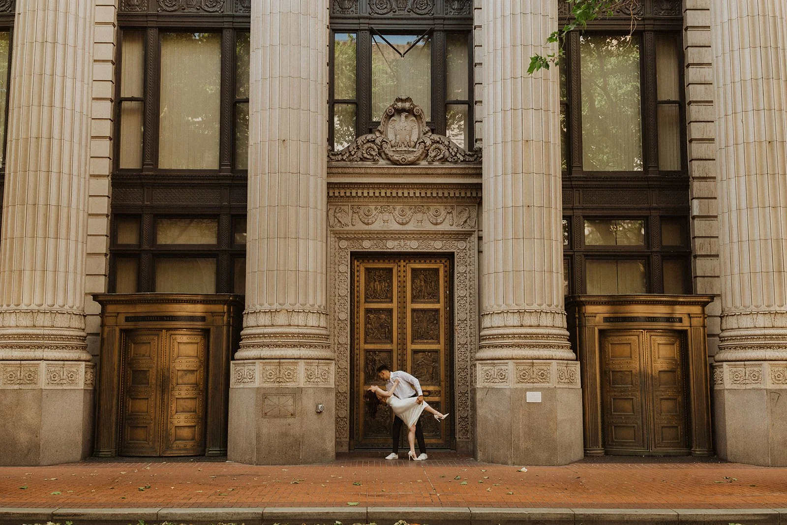 Couple exploring downtown during their urban engagement photos in Portland, Oregon