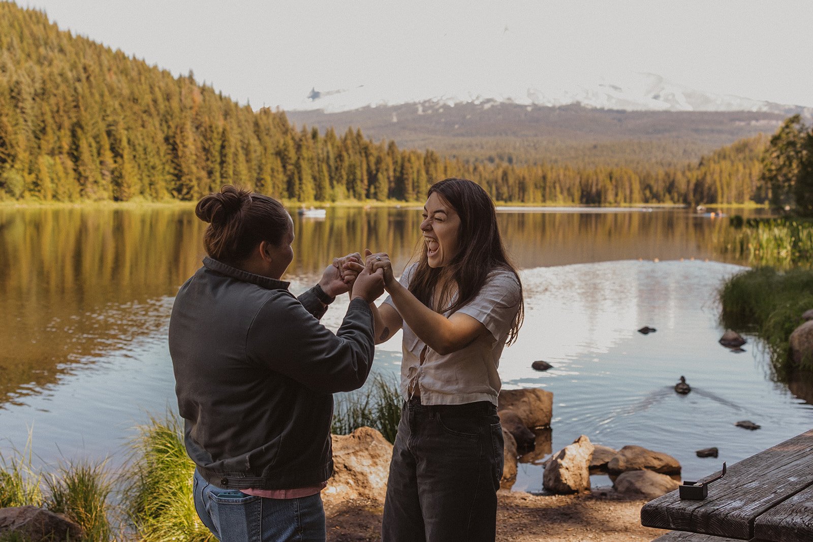 Laughing hard with the ring finally on beside the water at Trillium Lake