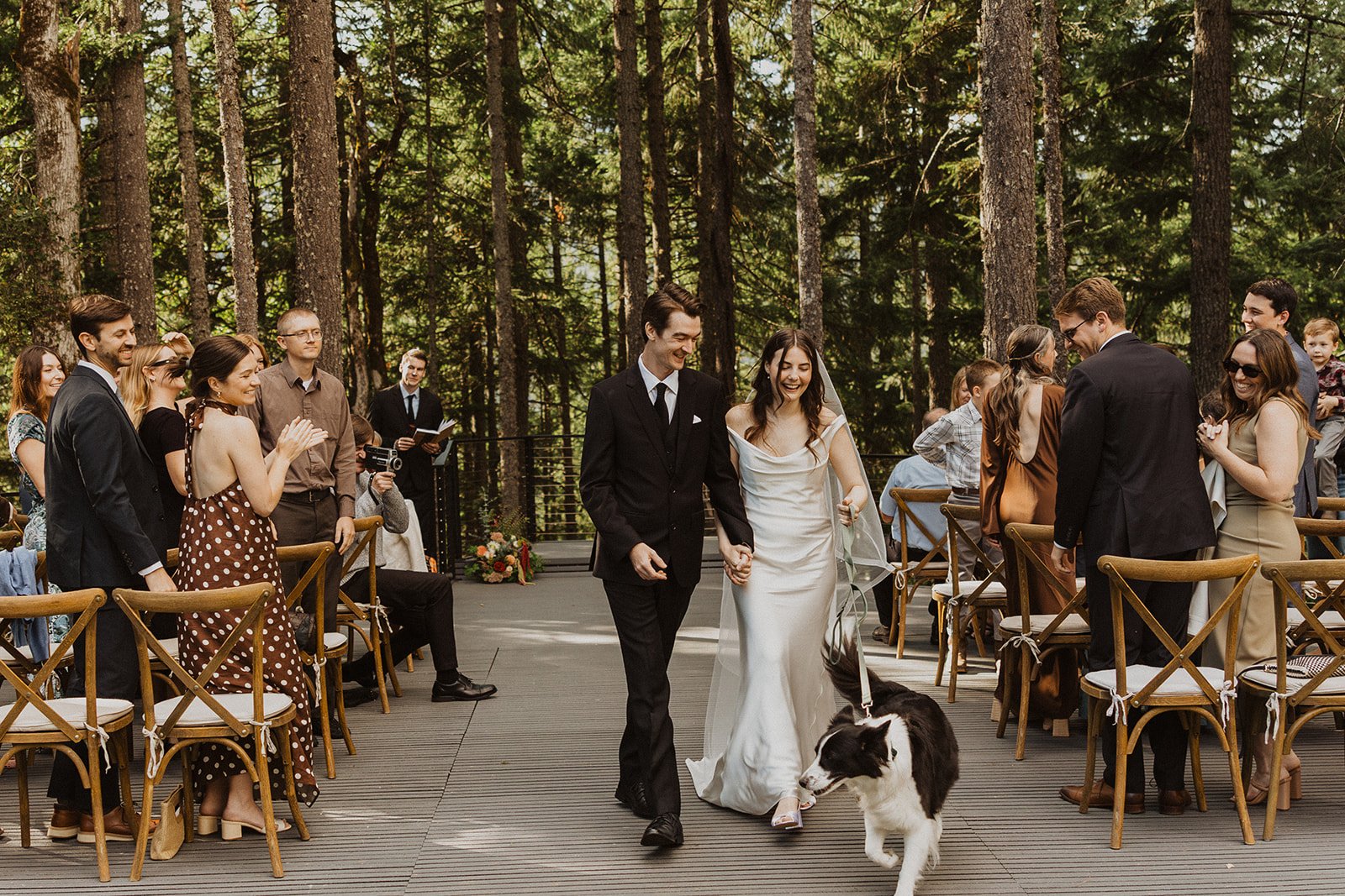 Guests standing and clapping as the newlyweds pass at Rocky Hill