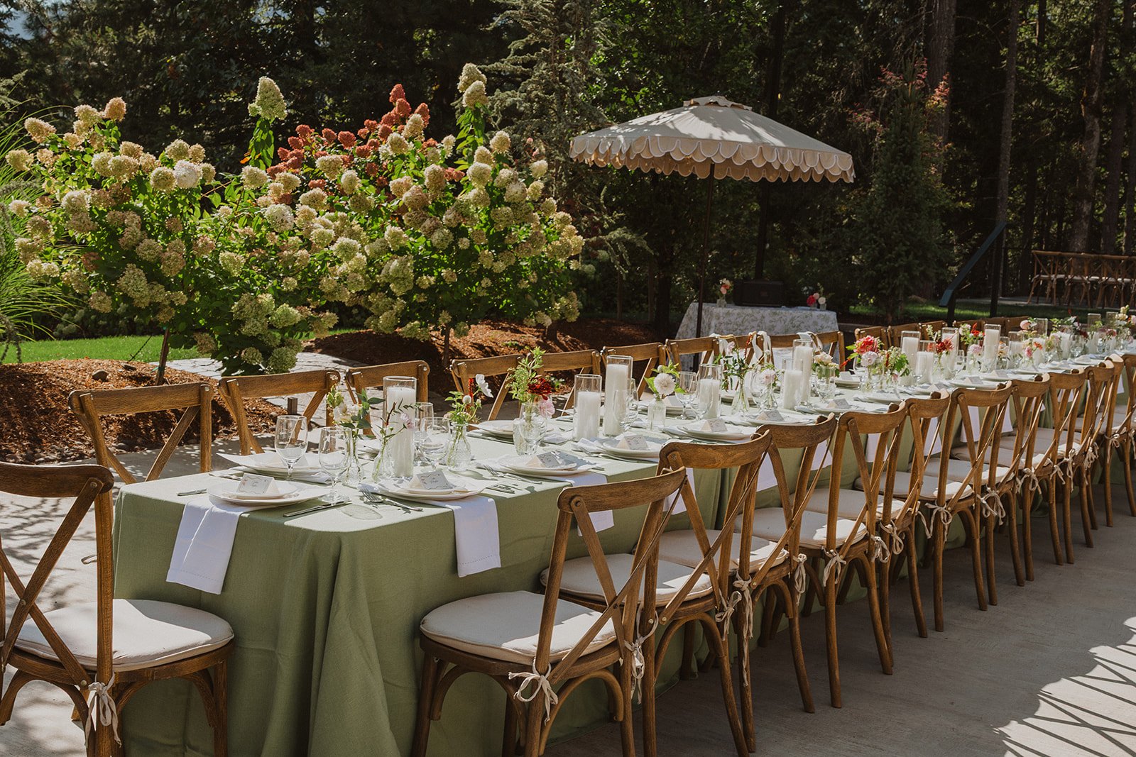 Long reception table under a scalloped umbrella at a Rocky Hill wedding