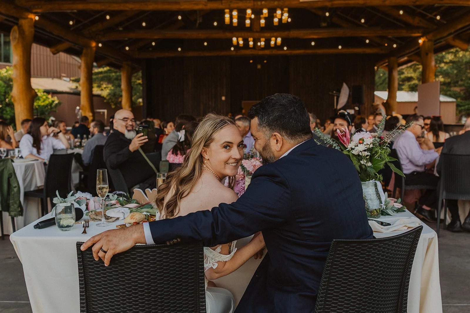 Guests gathered around couple after the cocktail hour winds down