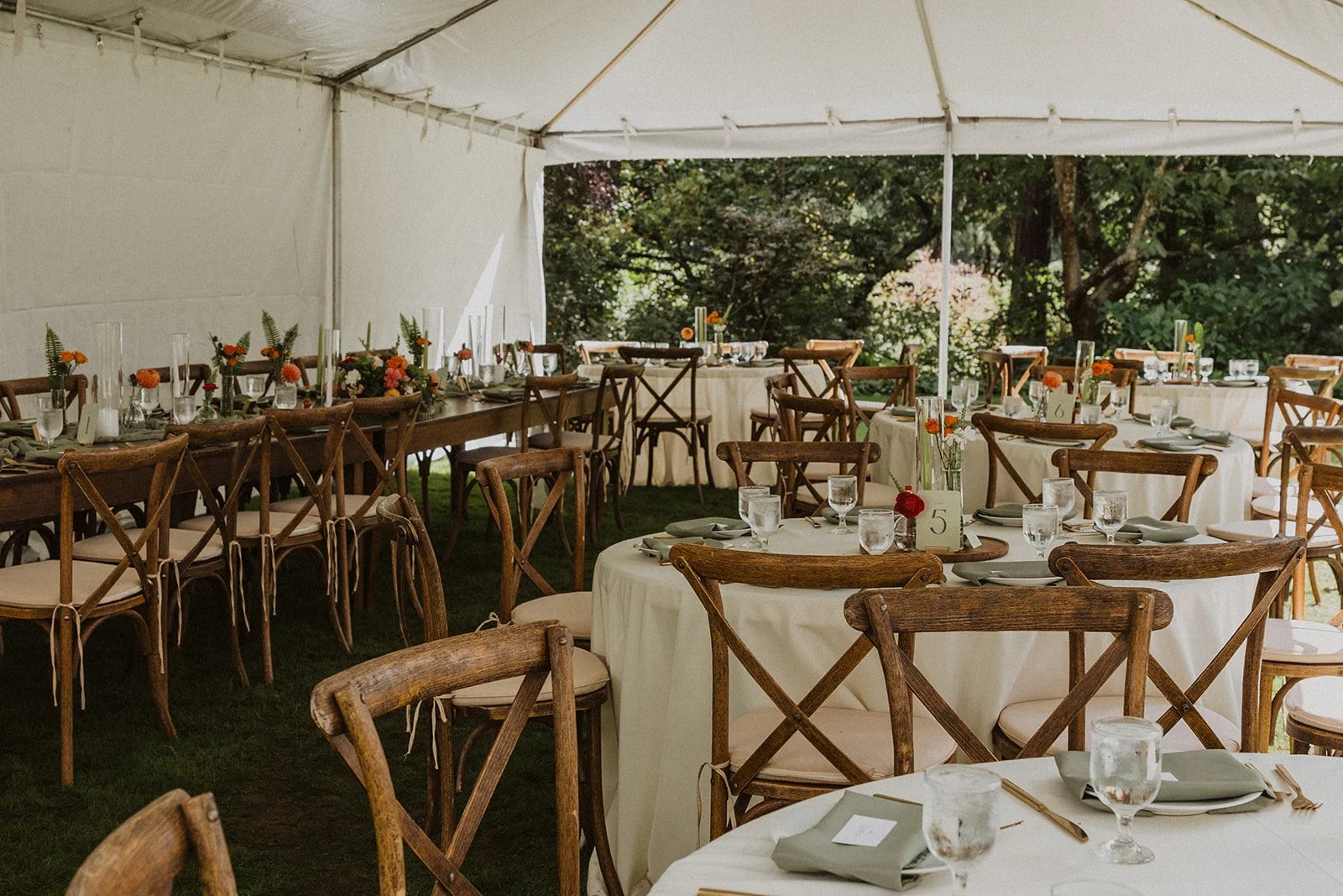 White tent reception set on the Meadow lawn at Crystal Springs Rhododendron Garden