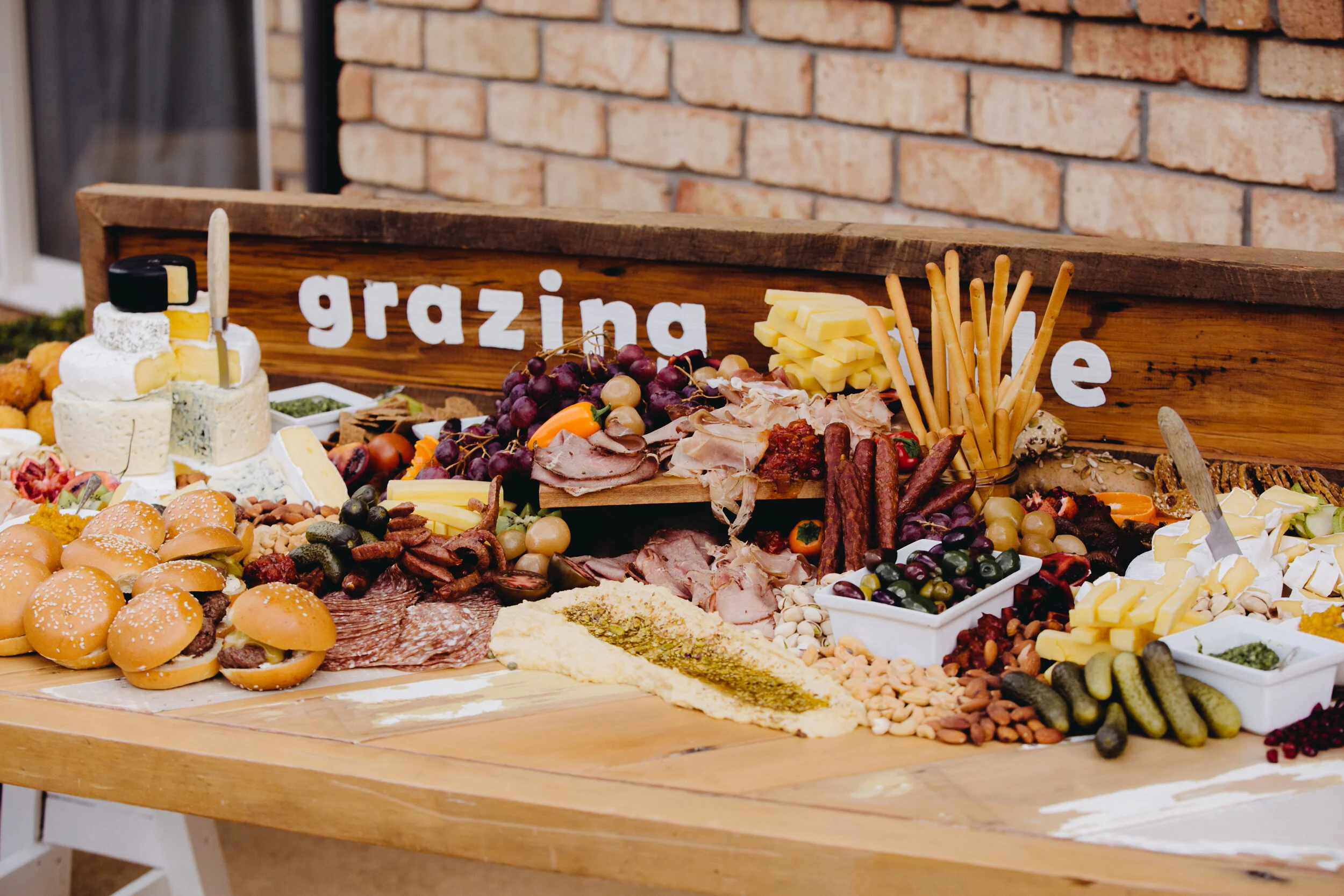 Love Club’s rustic signage &amp; rimu grazing table