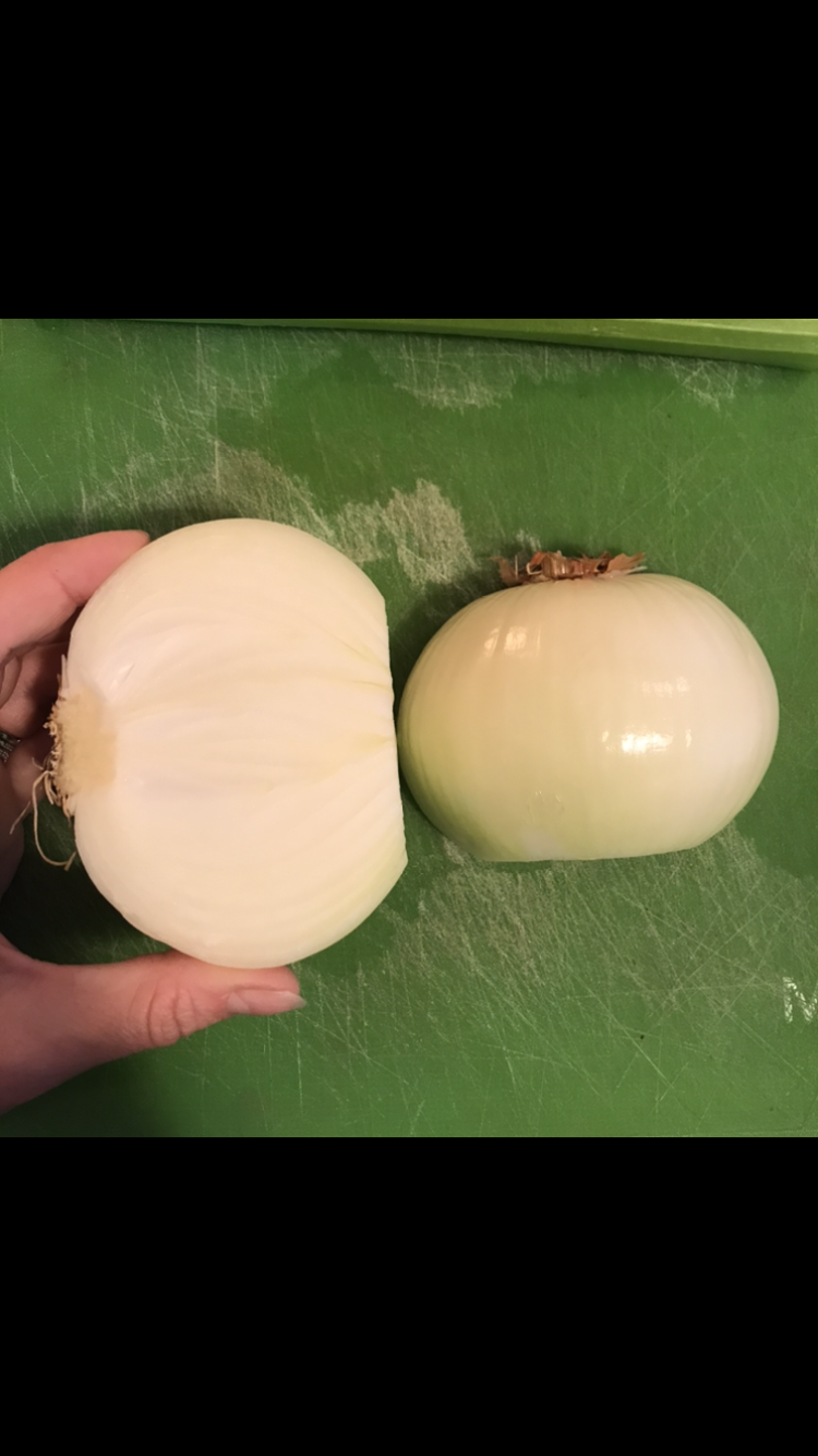 Peel onion, chop off top but leave root intact, slice in half