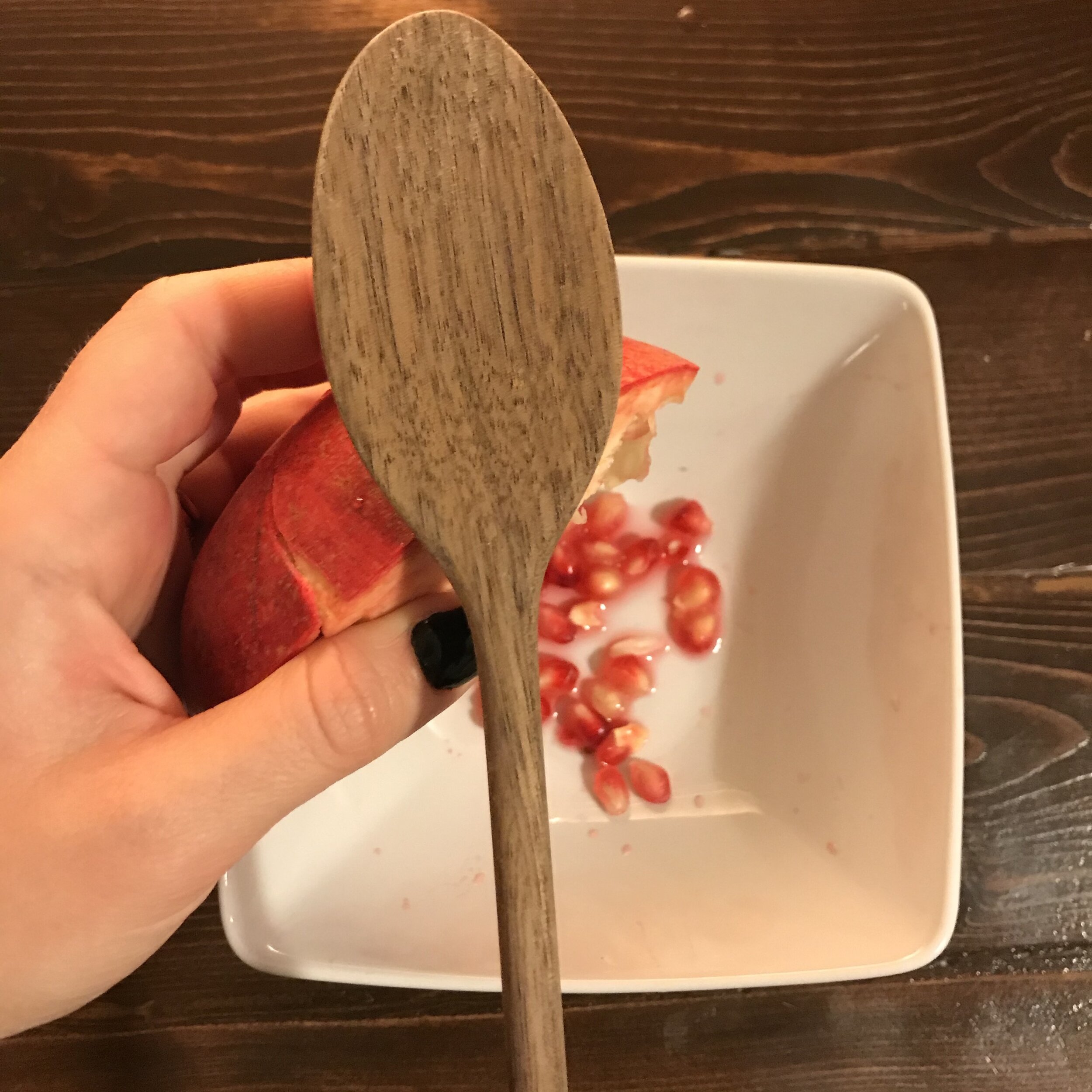 Hit the back with spoon to remove seeds