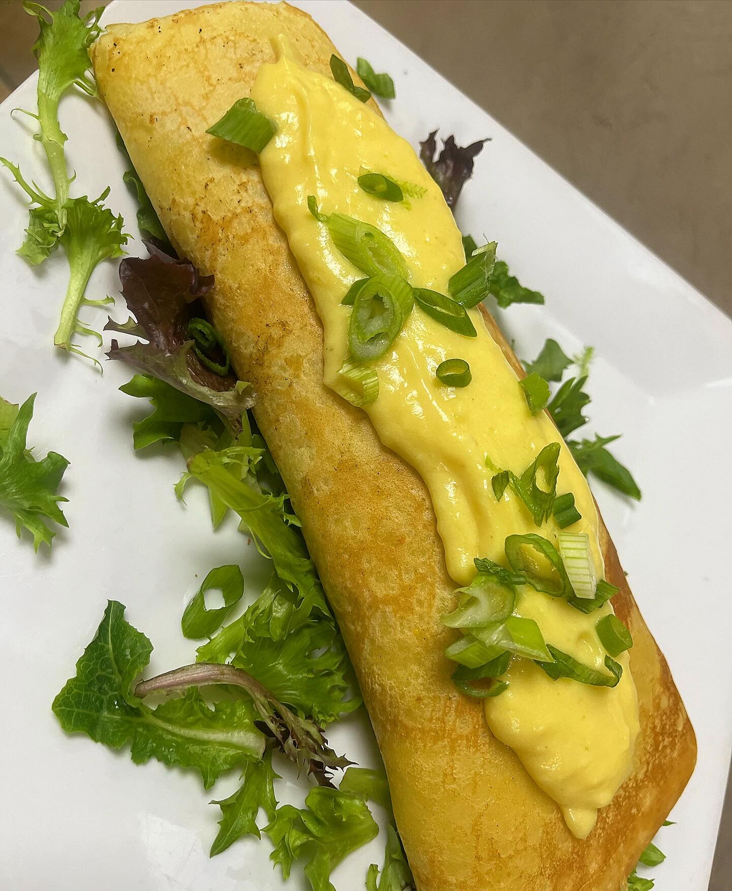 Holy crepe! These Florentine crepes are realllly good. Stuffed with egg, roasted red pepper, spinach, and provolone. Topped with hollandaise and scallions. Get &lsquo;em while they last. #NoOtherDeli