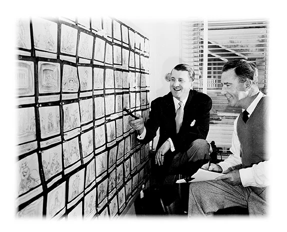 Sutherland (left) goes over storyboard with a colleague