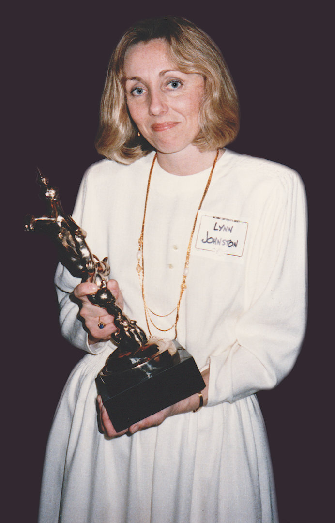 Lynn with her first Reuben Award, in 1986. She was the first woman (and the first Canadian) to win the Reuben Award, given by the National Cartoonists Society to the top cartoonist of the year.