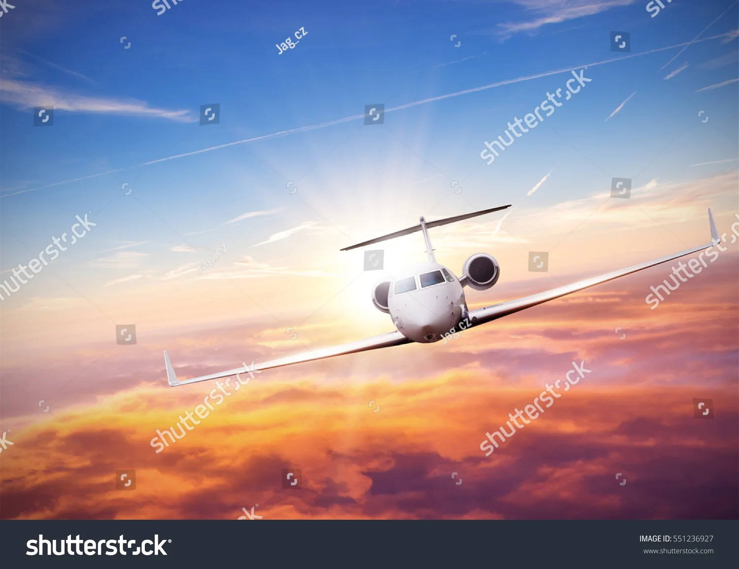 stock-photo-private-jet-plane-flying-above-clouds-in-beautiful-sunset-shot-from-front-view-high-resolution-551236927.jpg