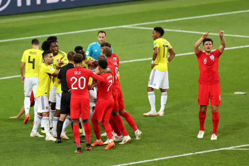 Alex Morton/Getty Images - England's Harry Maguire (6) requests for VAR review