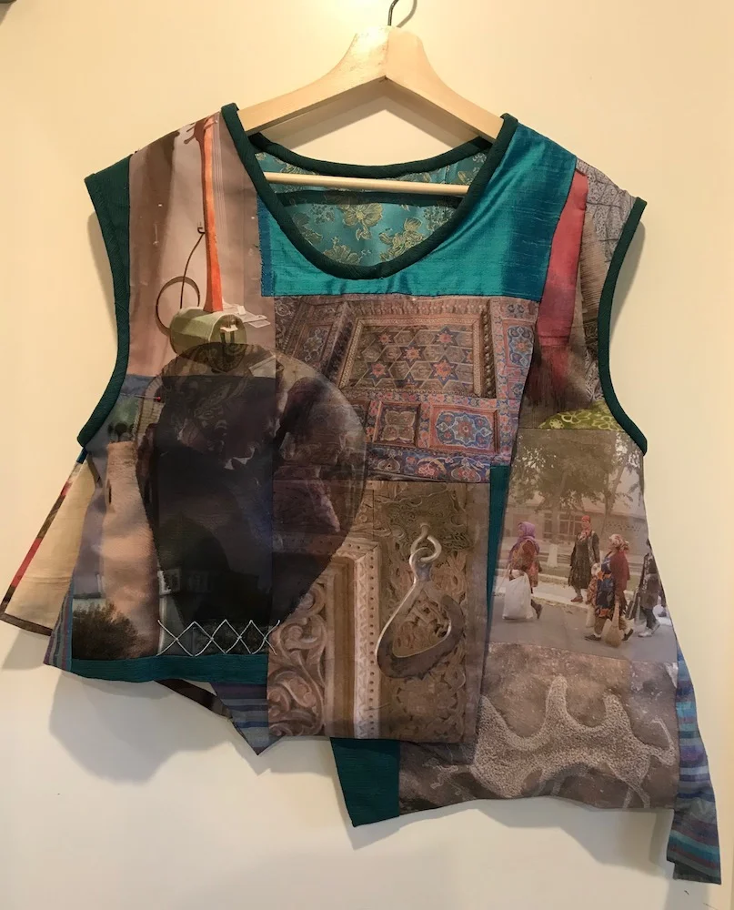 Susanne C Scott infotectives@gmail.com Memories of the Silk Roads 36"x30"x6" NFS but will accept comissions This vest is a collage of photographs taken on my Silk Roads adventure digitally printed on silk and cotton assembled, with other silks and brocades, into a wearable garment. While this piece is my personal memory of this adventure, I am very interested in building a similar wearable garment for other adventurers or memorists.
