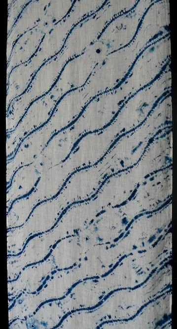 Erica Iseminger eeisemi@gmail.com Ori Nui Ripple Indigo dyed organic cotton gauze scarf 76" x 18 $175 This is a traditional Japanese shibori pattern of undulating lines( Takewaku) done in an ori-nui stitch. Areas were blocked out to resist the uptake of the indigo dye.