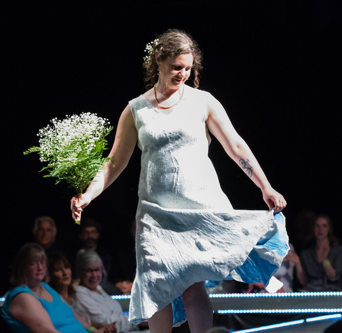 Wedding Dress By The Sea 2018 Donna Lark Port Townsend doelark@gmail.com A change from coats and vests Donna’s previously shown on the runway (5 in 3 years!), she created this sheer reversible dress by Nuno felting mulberry silk lap, merino wool and lace. Later, artist Pat Herkal, in preparation for their future collaboration, added beaded embellishment to the dress. Model: Lauren Lark Photo: Deja Webster