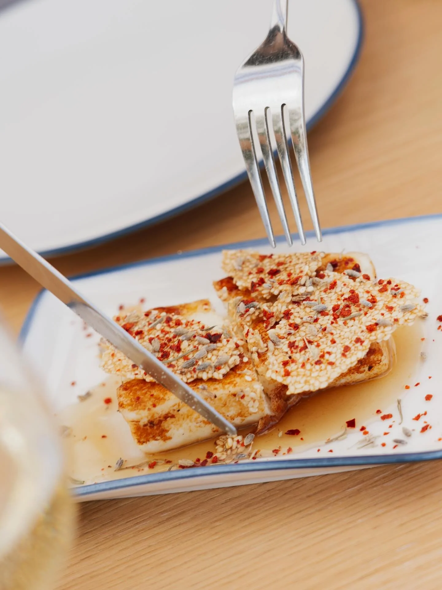 Halloumi with our house fermented lavender chamomile honey, paired with a sesame biscuit.
