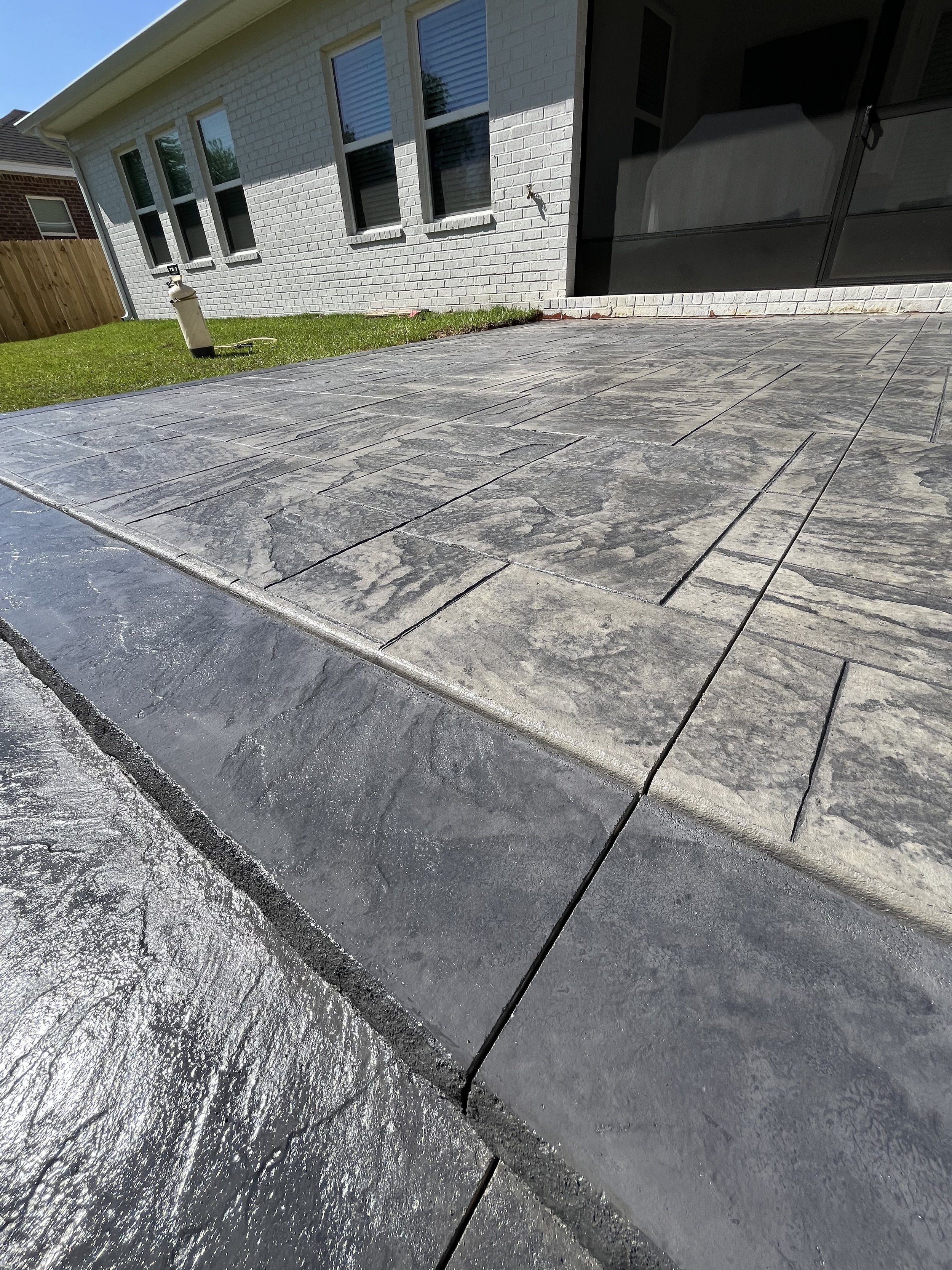 Concrete Patio Stamped with Avalon Ashlar with Custom Concrete Step - Fairhope, Alabama