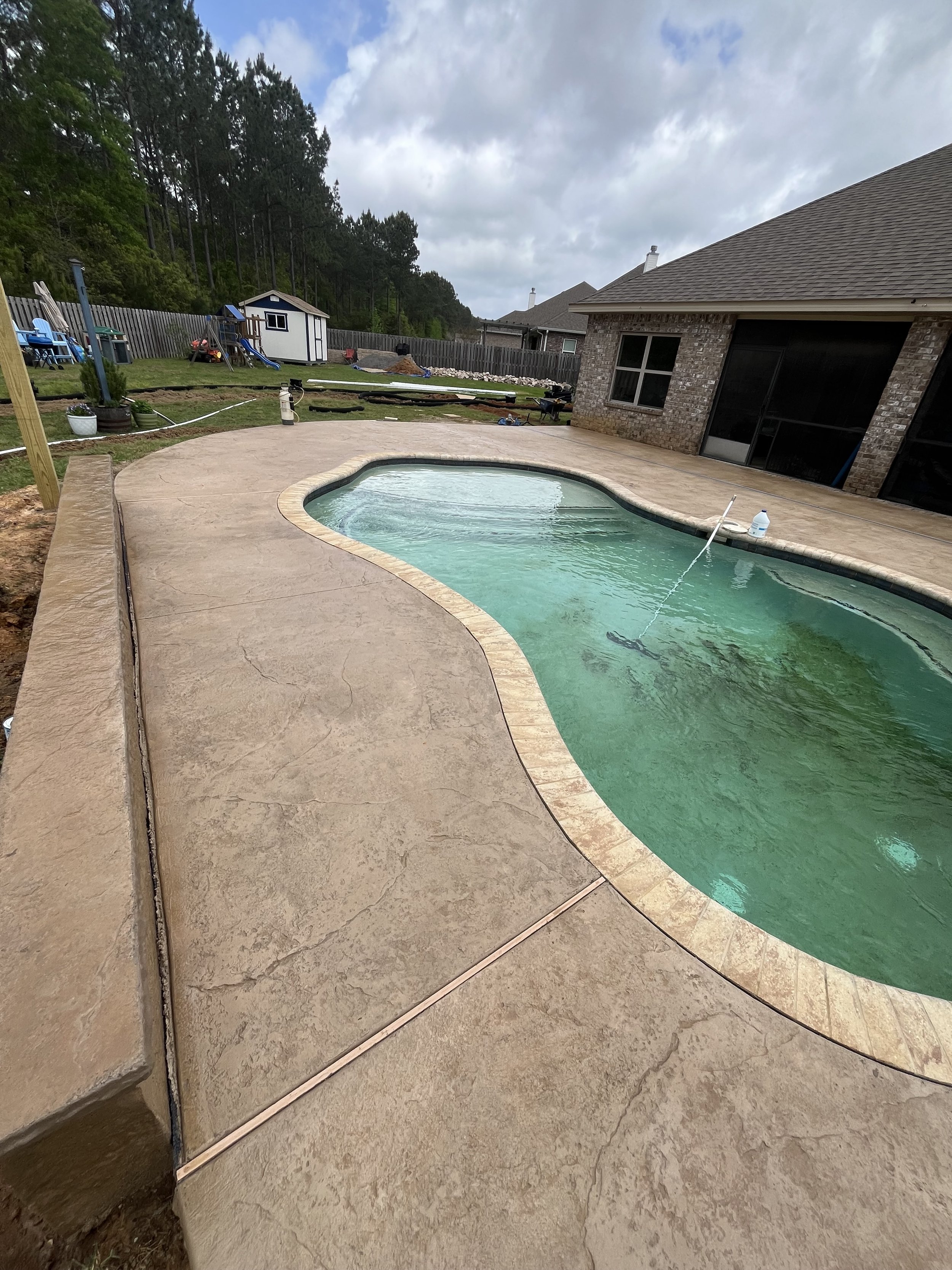 Look at the definition of the texture! One of a kind on this Pool Surround - Spanish Fort, Alabama