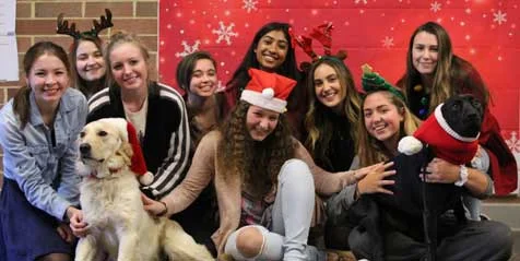 Students at Central Bucks High School East posed with Roxy therapy dogs Josie and Dizzy for a fun holiday photo.