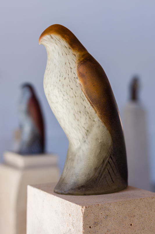  "Copper Cash," detail Hand blown pigmented glass on limestone figure: 13 x 6 x 7 inches 