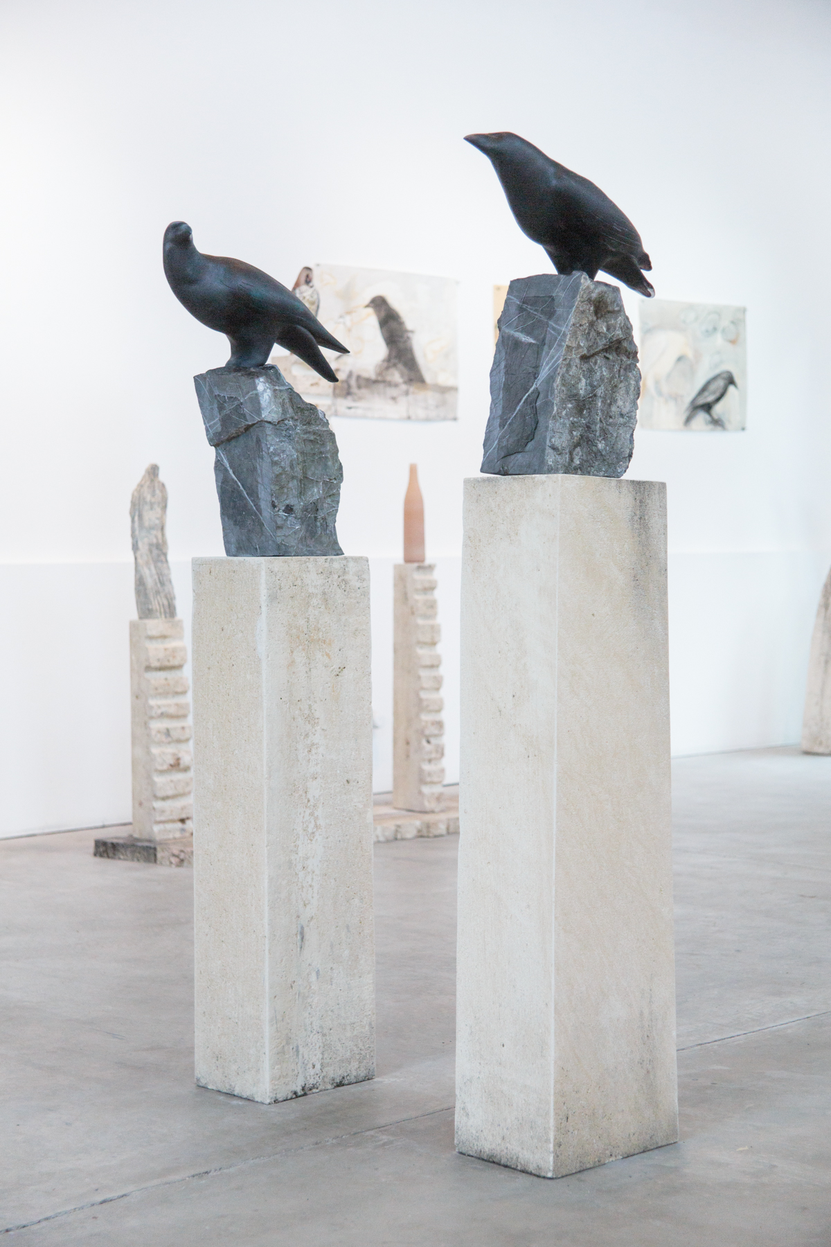  “Ravens (Male and Female),” 2018 Hand blown pigmented glass, marble and limestone  60 x 8 x 16 inches (Female) 63 x 8 x 15 inches (Male) 