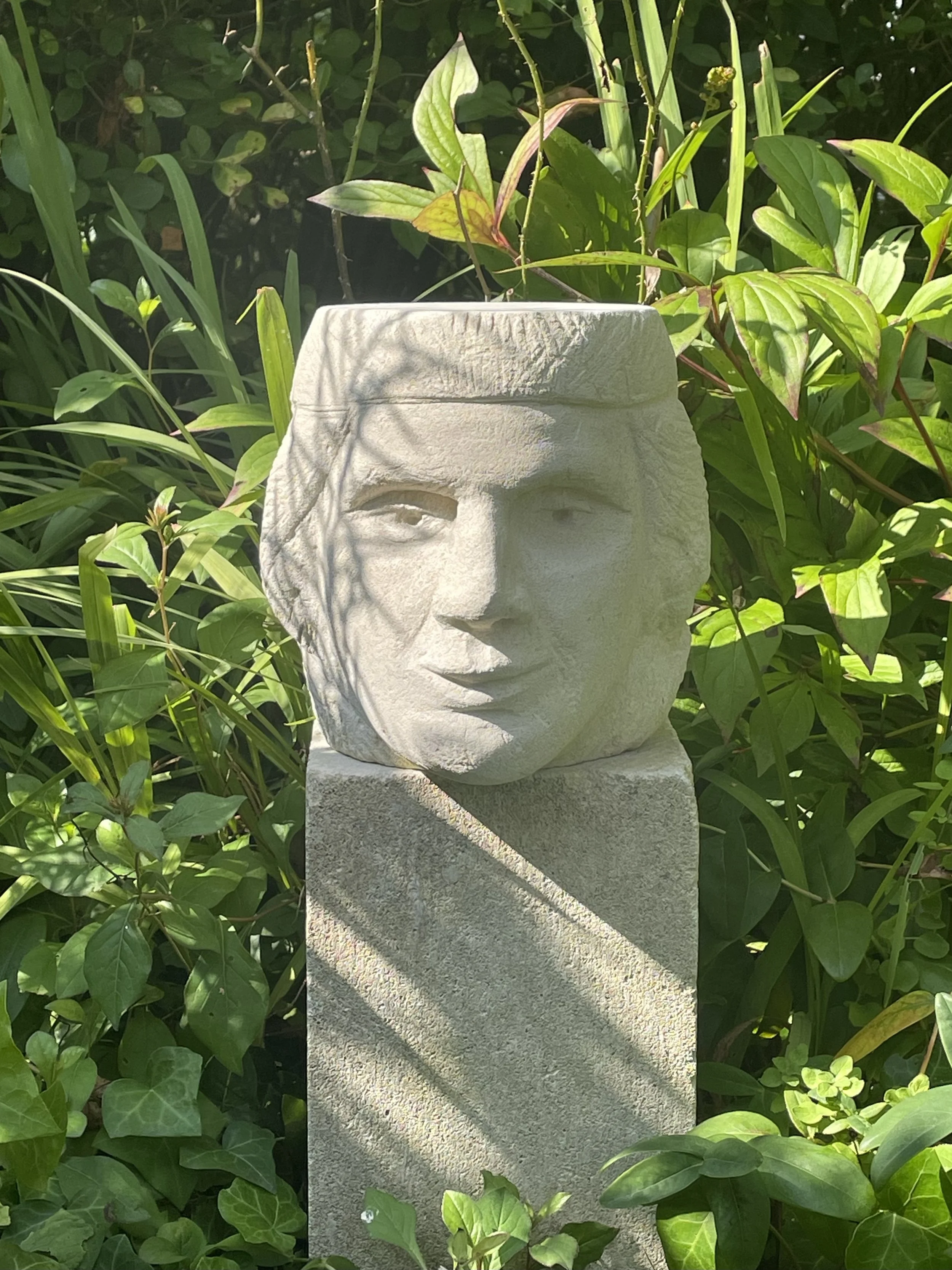 Stone Head 1 in garden.jpg