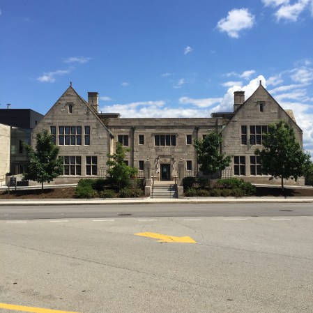 The front of the old building, with a new bus/carpool drive in front of it. The new addition begins in the leftmost part of the photo.