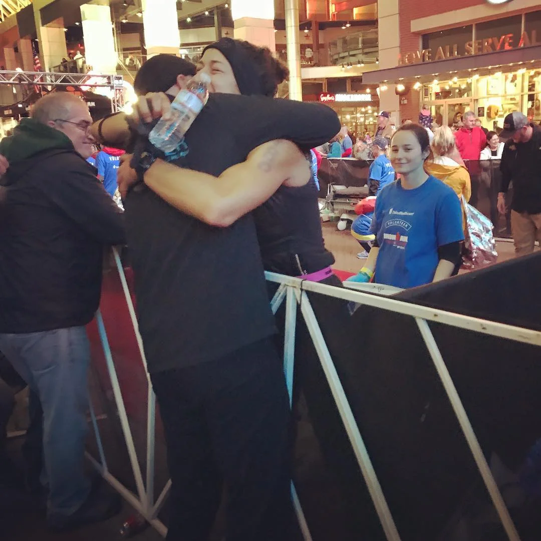 Lauren and her coach after completing an Ironman.