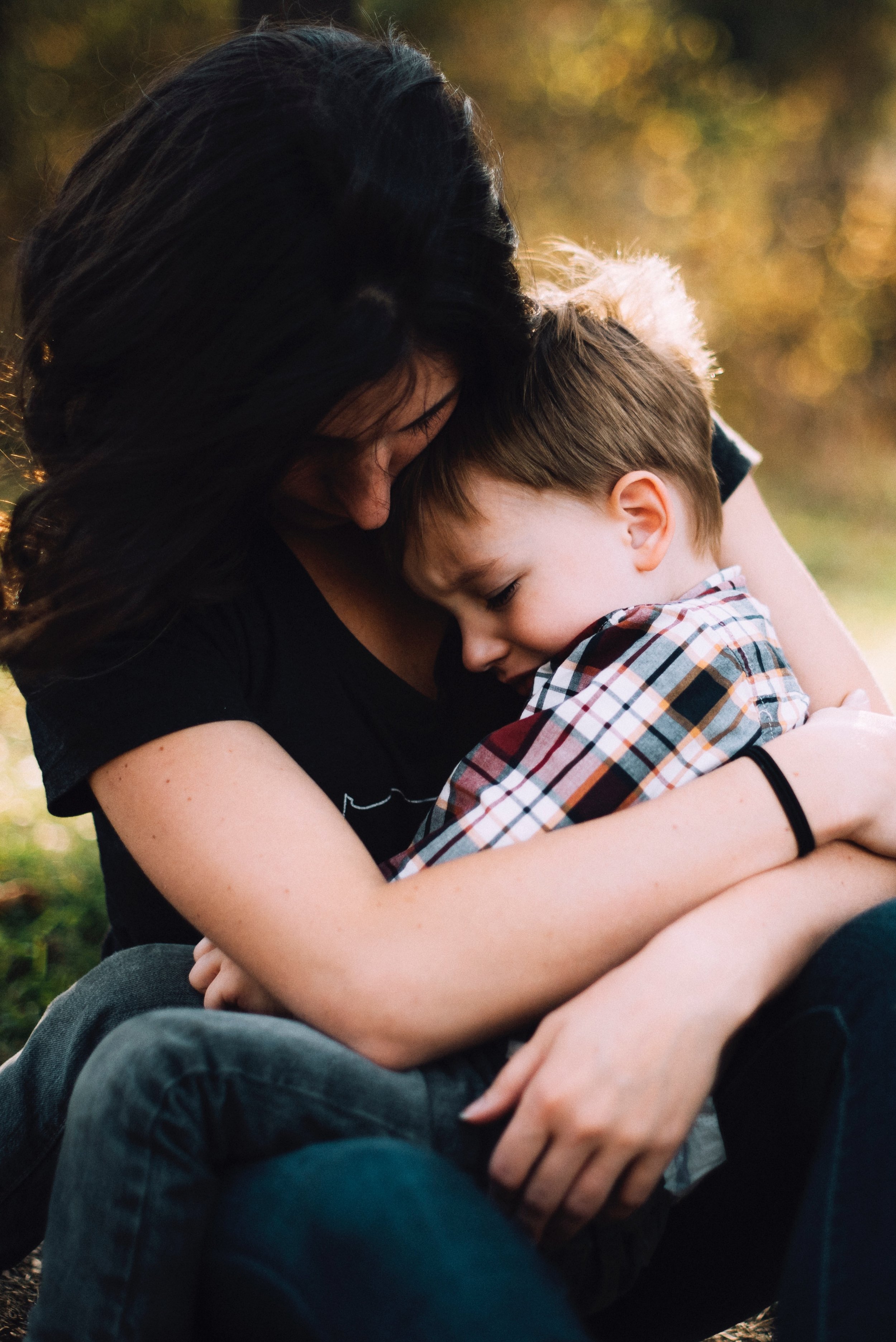 jordan-whitt-145327-unsplash mom with boy in plaid shirt.jpg
