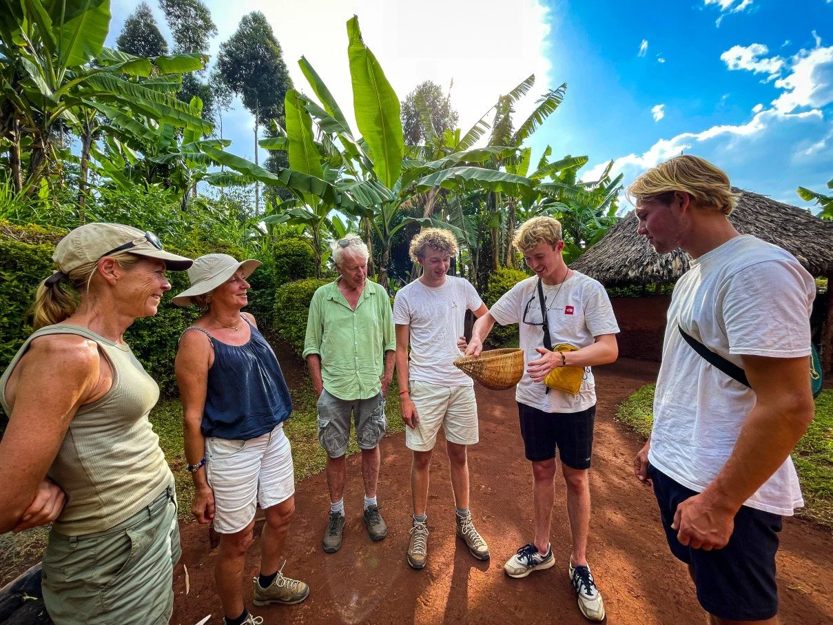 A Dutch family during an interactive coffee experience in the Community of Sipi Falls, near Kapchorwa.