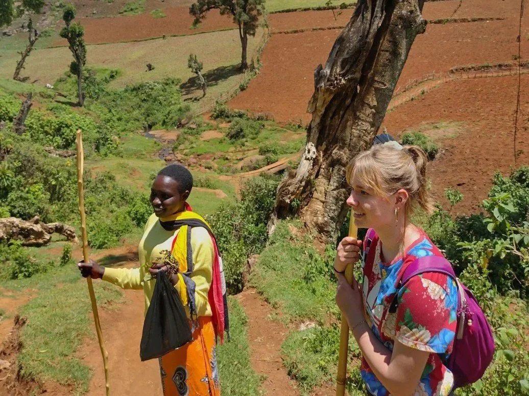 Female solo traveler along the Mosopisiek Trail in the highlands of Kween District