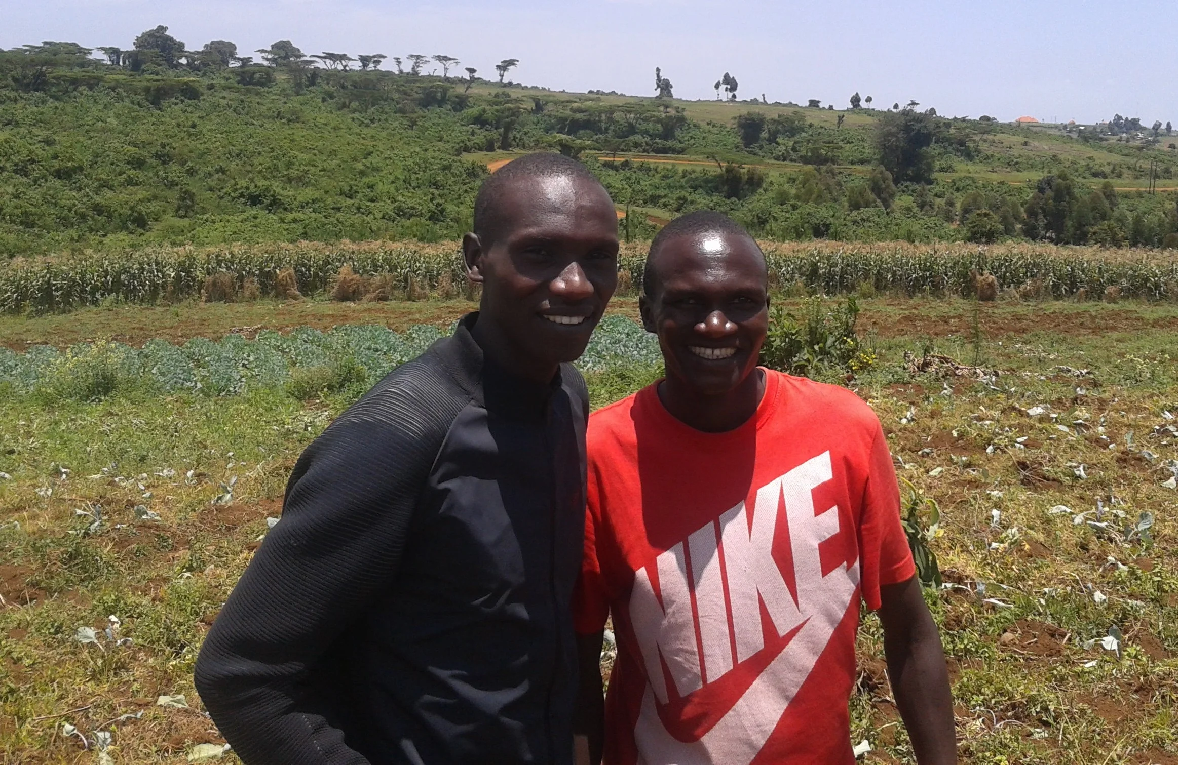 Joshua Cheptegei and Stephen Kiprotich during a spontaneous meet and greet at Stephen's farm in 2016