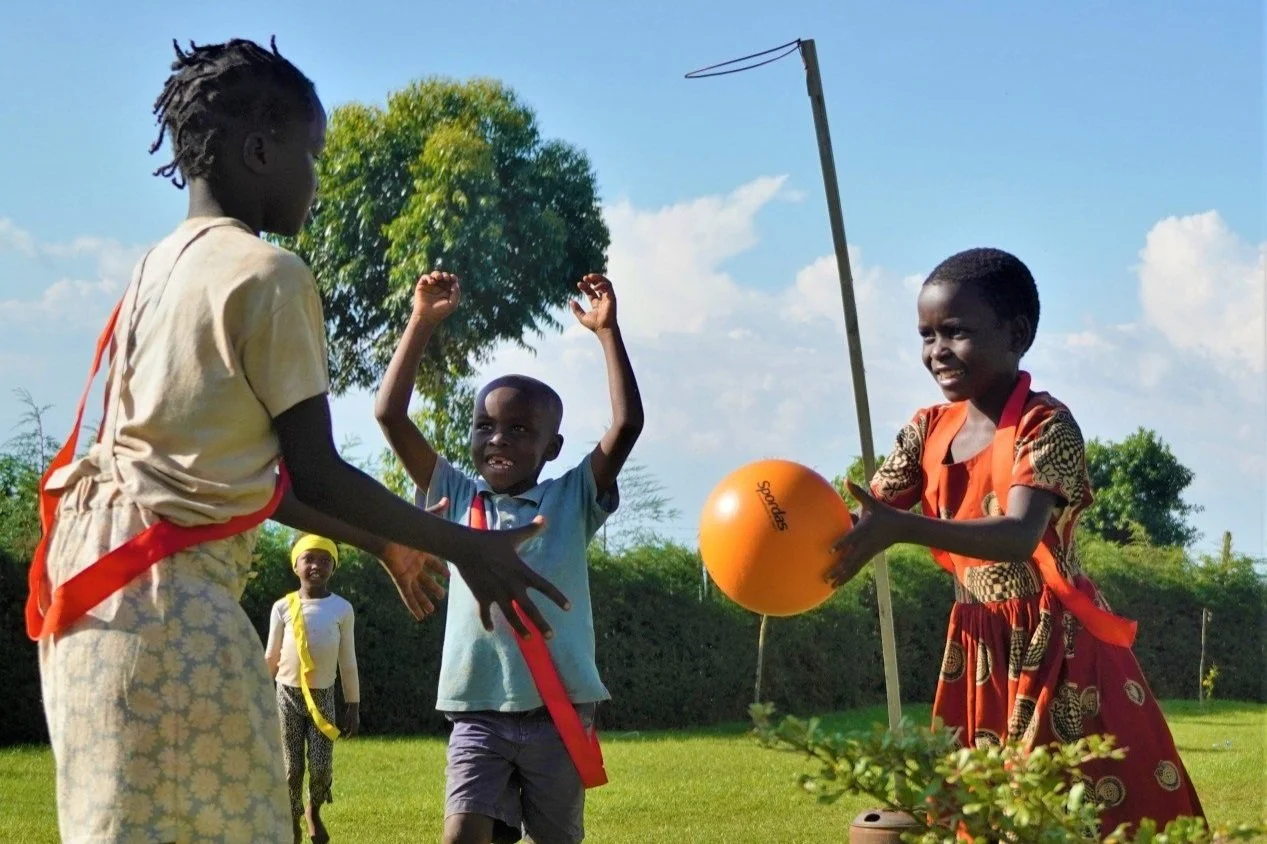 Children from the Kapchorwa Community enjoying a game of netball @ Home of Friends Guesthouse