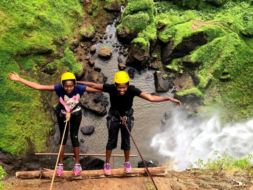 Home of Friends host Eliza together with her sister during the abseiling in Sipi Falls