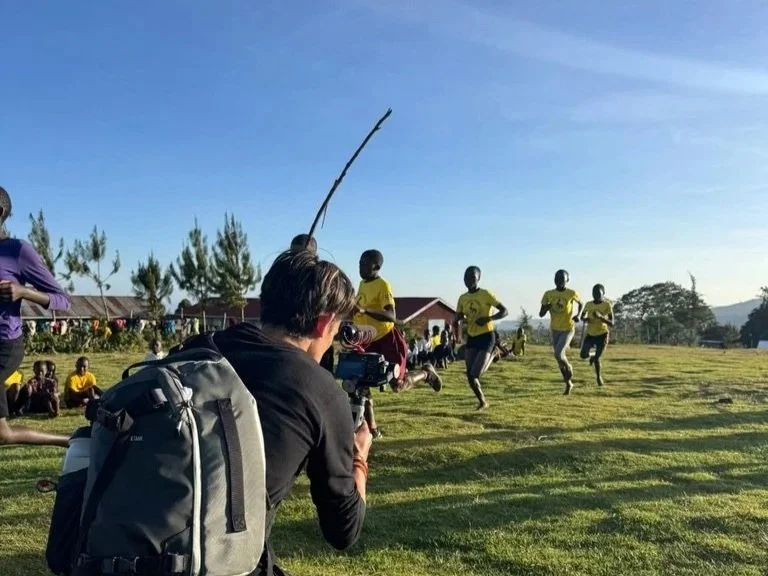 Mauro filming for his Kapchorwa running culture documentary during a youth running event in Tuban village