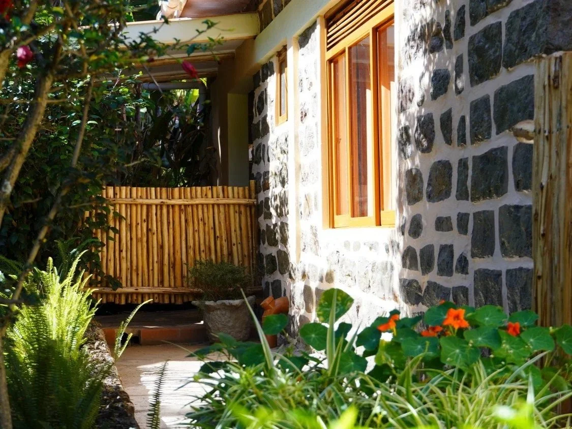 Home of Friends Guesthouse garden with natural flowers and a cosy ambiance.