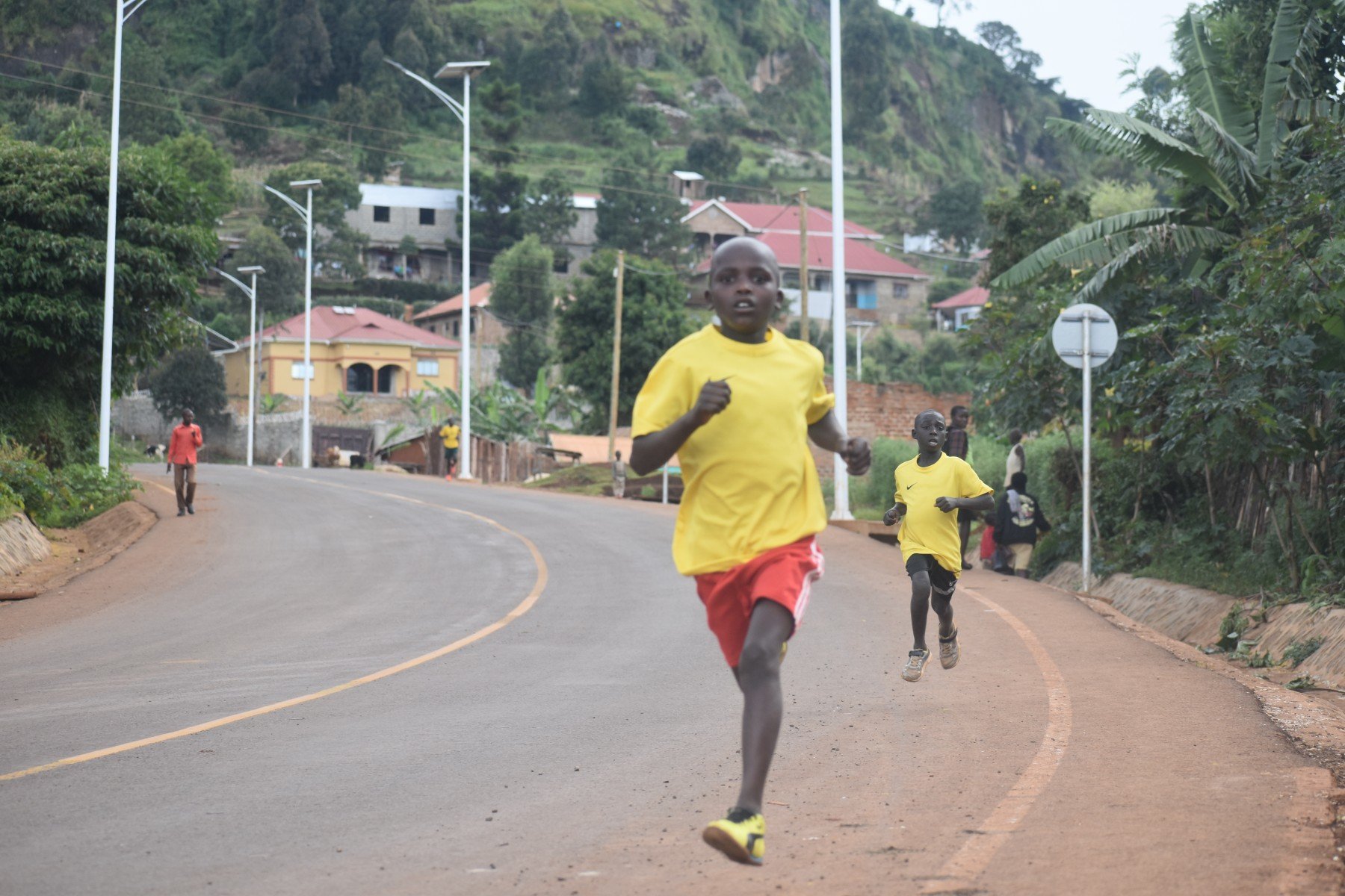 Young and talented Kapchorwa runner on the Teryet road, Mount Elgon