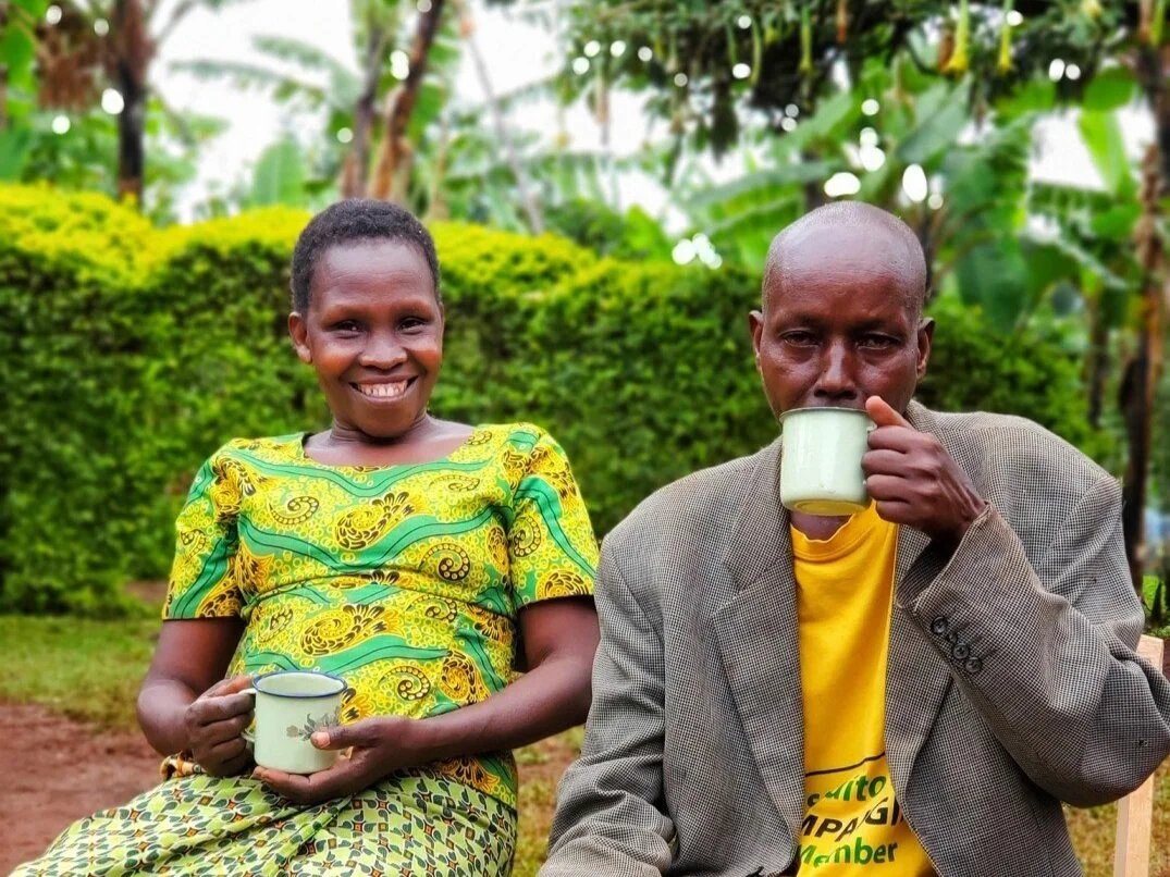 A happy coffee farmers couple in Sipi Falls sipping from their Arabica coffee.