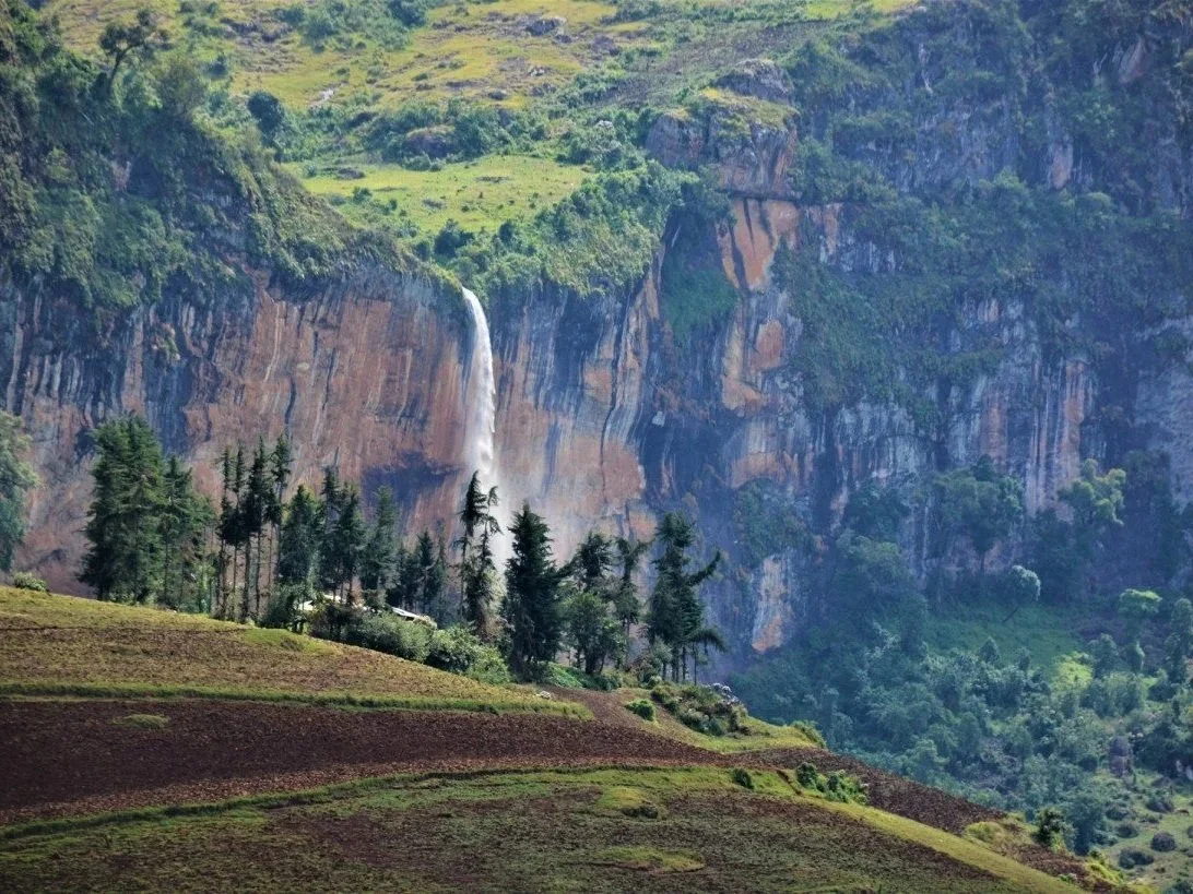 The splendid and untouched Mengia waterfall in the higher belts of Kween District, Uganda, East Africa.