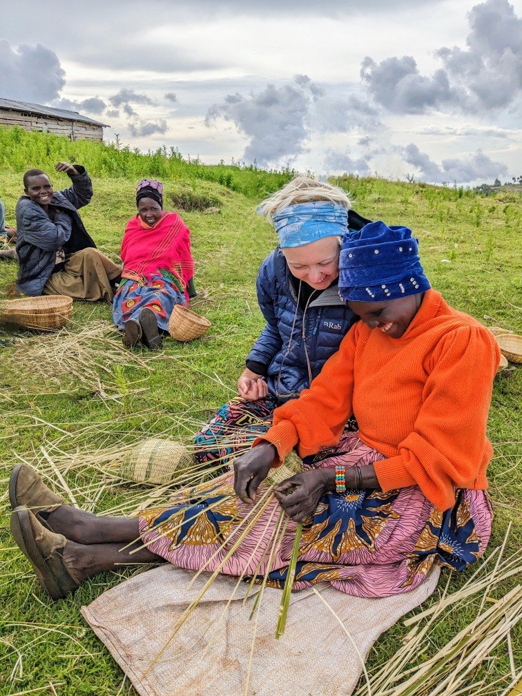 Laughter and joy during a bamboo basket weaving experience along the Mosopisiek Trail. Mount Elgon, Uganda.
