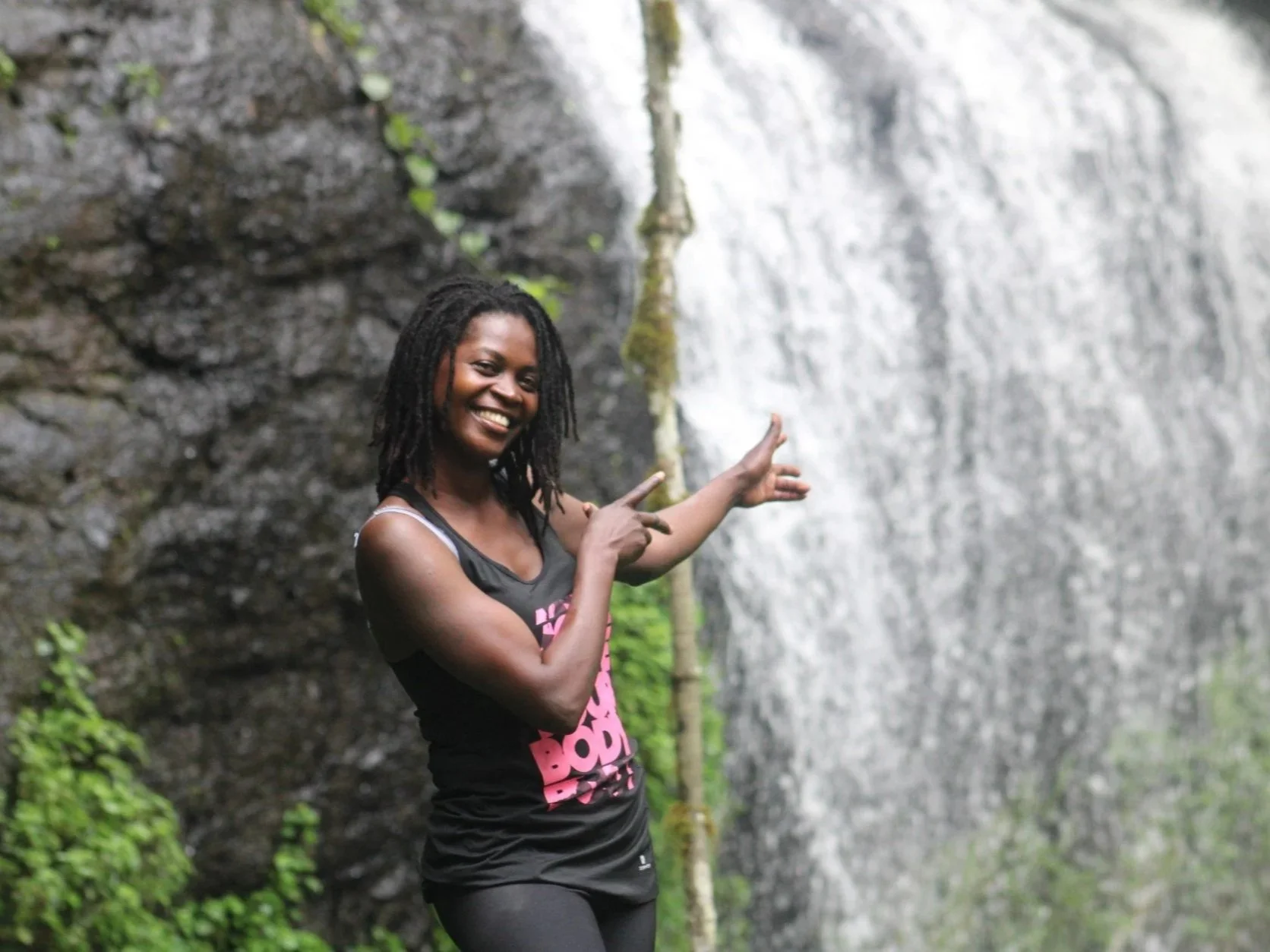 Eliza (Home of Friends) showing a Kapchorwa waterfall, Mount Elgon in Uganda.