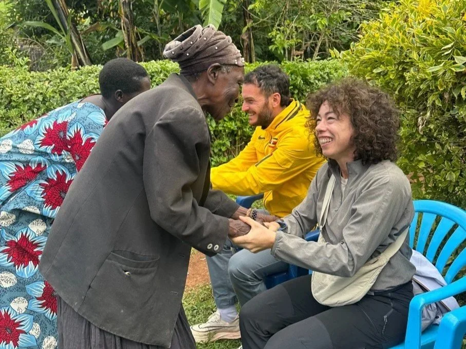 A warm welcome by the Kapchorwa mamas during a cooking experience on Mount Elgon, East Africa.