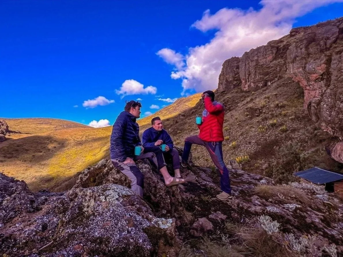 Hikers at the Mwongogo cave restpoint. Mount Elgon National Park, Uganda.
