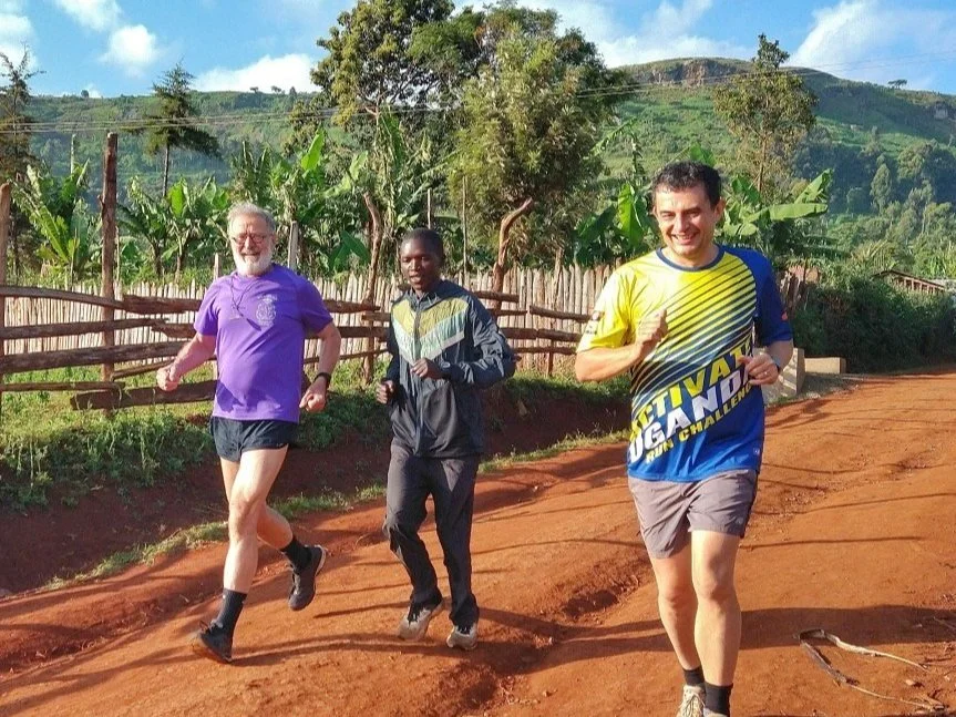Belgium visitors enjoying a guided run with one our native Kapchorwa athletes on a red dirt trail near Kapchorwa Town